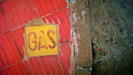 Gas word on street floor backgroundの写真素材
