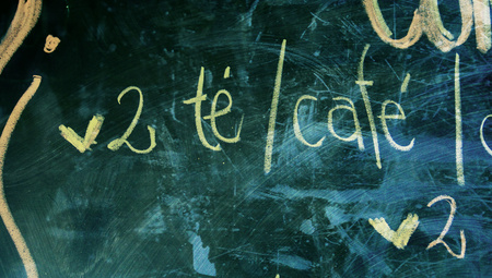 Tea and coffee words on grunge chalky blackboard for twoの写真素材