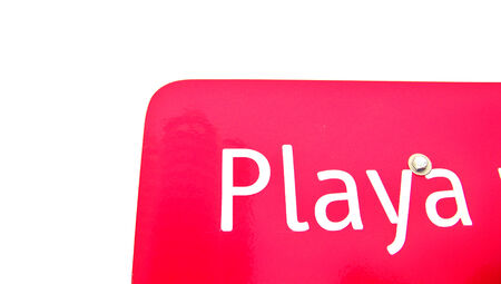 Beach red signal close up isolated on white background, in spanishの写真素材