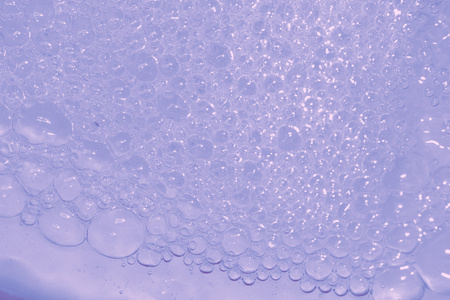 Blue soap bubbles textured background closeup