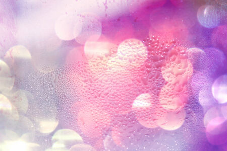 Pink and purple lights blurs abstract background の写真素材