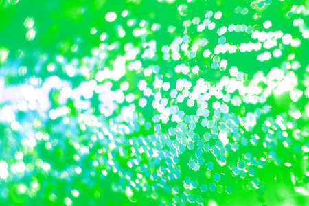 Green party celebration lights abstract background with hexagonal little shapes of lightの写真素材