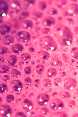 Pink foam bubbles textured abstract background closeupの写真素材