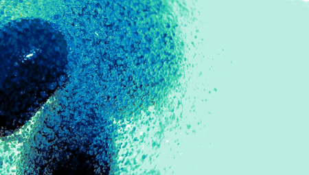 Blue paint drop in small water bubbles abstract backgroundの写真素材