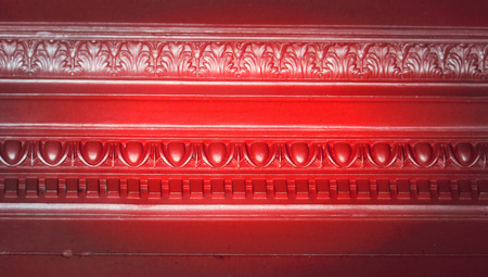 Red light on vintage wall abstract background closeupの写真素材