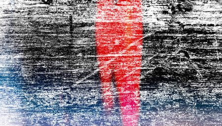 Red blasting color on grungy dark wood wall backgroundの写真素材