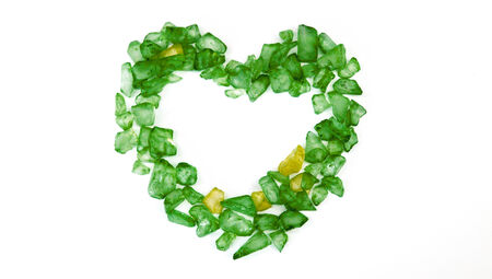 Green xmas heart of small stones isolated on white backgroundの写真素材