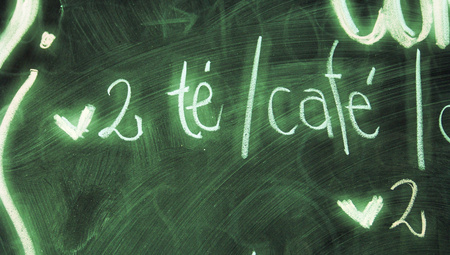 Couple of tea or coffees chalk bar menu handwritten letters closeupの写真素材