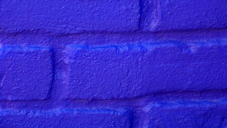 Brilliant blue brick wall closeup abstract background