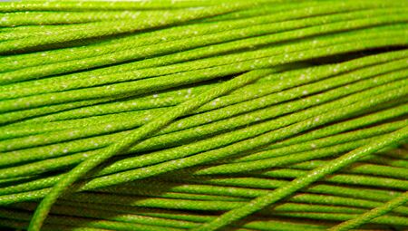 Light green cord material close up abstract background