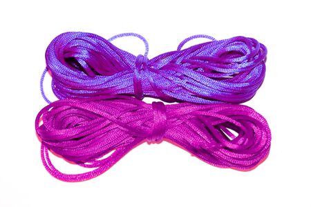 Blue and purple silk yarns isolated on white
