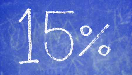15 percent of chalk on blue blackboard backgroundの写真素材
