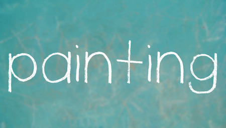 Painting chalk word on blackboardの写真素材