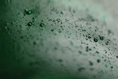 Green little drops macro abstract background