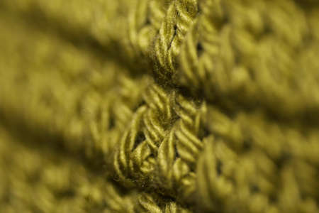 Olive green knots crochet backgroundの写真素材