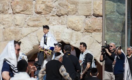 JERUSALEM, ISRAEL - Feb 18, 2013: Bar Mitzvah ritual at the Wailing wall in Jerusalem. A 13 years...