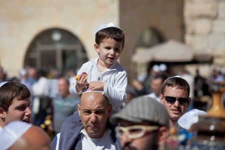 JERUSALEM, ISRAEL - Feb 18, 2013: Bar Mitzvah ritual at the Wailing wall in Jerusalem. A 13 years...