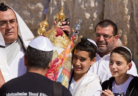 JERUSALEM, ISRAEL - Feb 18, 2013: Bar Mitzvah ritual at the Wailing wall in Jerusalem. A 13 years...