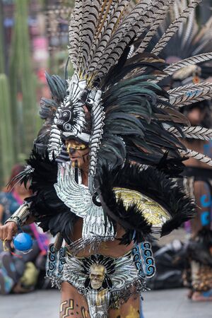 Mexico City, Mexico - April 30, 2017: Aztec dancers dancing in Zocalo square