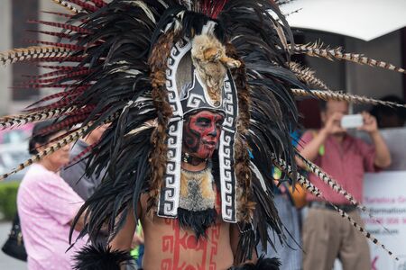 Mexico City, Mexico - April 30, 2017: Aztec dancers dancing in Zocalo square