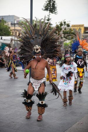 Mexico City, Mexico - April 30, 2017: Aztec dancers dancing in Zocalo square