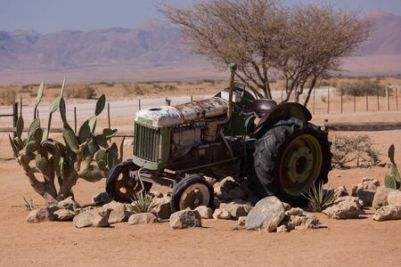 Abandoned old rusty wrecked historic car near a service station at Solitaire in Namibia desert ear the Namib-Naukluft National Park.の写真素材