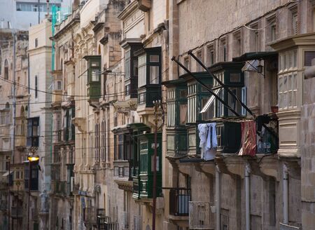 Famous colorful wooden balconies in narrow streets of Malta, Valleta. Architectural Maltese feature of of the island.の写真素材