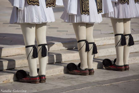 Athens, Greece - May 01, 2019: Greek soldiers Evzones dressed in traditional unusual uniforms, refers to the members of the Presidential Guard, an elite ceremonial unit. Hourly changing of the guardのeditorial素材