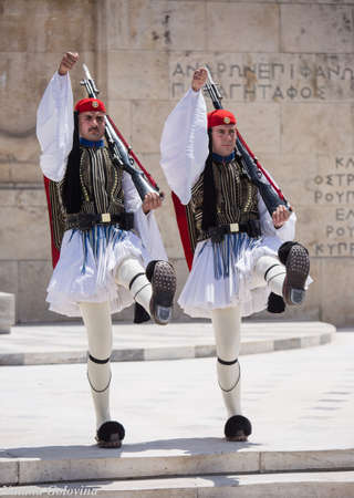Athens, Greece - May 01, 2019: Greek soldiers Evzones dressed in traditional unusual uniforms, refers to the members of the Presidential Guard, an elite ceremonial unit. Hourly changing of the guardのeditorial素材