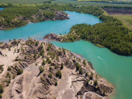 Fancy and unusual aerial landscape of Romantsev mountains wih blue lakes and mud erosion looks like...