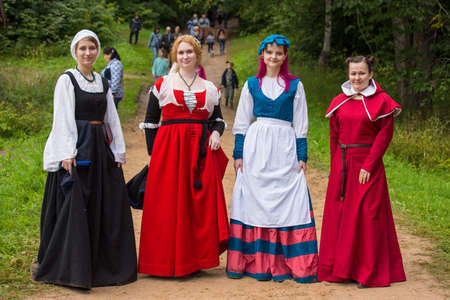 Torzhok, Russia -August 15, 2020: Historical interpreters reconstruction in european medieval costume.Portrait of a woman in an old historical dress.のeditorial素材
