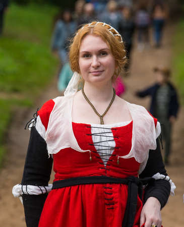 Torzhok, Russia -August 15, 2020: Historical interpreters reconstruction in european medieval costume.Portrait of a woman in an old historical dress.のeditorial素材