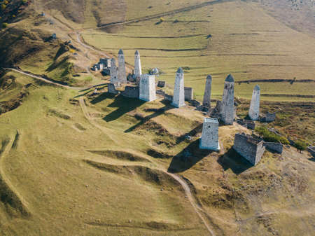 Aerial view of medieval ancient stone battle tower complex in the mountains of Ingushetia, Russia