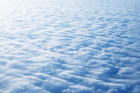 View from a flight. Cloud texture in blue color. Background.の写真素材