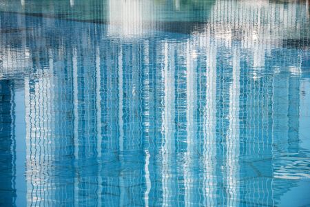 Reflection of Burj Khalifa tower in water. Dubai UAE