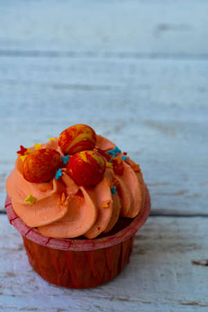 Easter cupcake with whipped orange cream. decorated with orange paint Easter eggs and pastry...