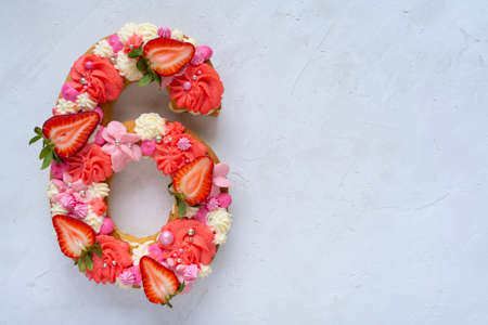 Birthday cake. Unusual modern design with strawberries. Spring time. Postcard for the holiday....