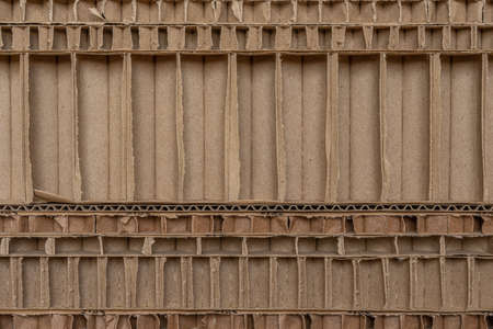 Brown cardboard with internal partitions.. Abstract textured background. Moving, garbage recycling....