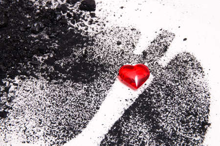 silhouette of human lungs from coal dust on a white background, lungs from pieces of coal and a small red glass heart, health care concept, respiratory diseases, copy spaceの写真素材