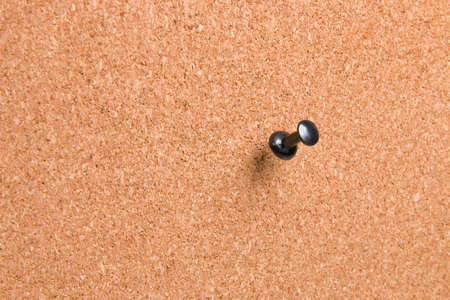black pin on cork board, copy spaceの写真素材