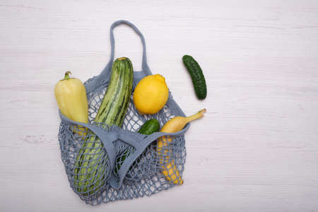 Zero waste cconcept. Package-free food shopping. Eco friendly natural bag with organic fruits and vegetables. Sustainable lifestyle concept. Plastic free items. Reuse, reduce, refuse. Top view.の写真素材