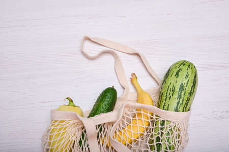 Zero waste cconcept. Package-free food shopping. Eco friendly natural bag with organic fruits and vegetables. Sustainable lifestyle concept. Plastic free items. Reuse, reduce, refuse. Top view.の写真素材