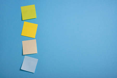 bright colored sticky notes on blue background