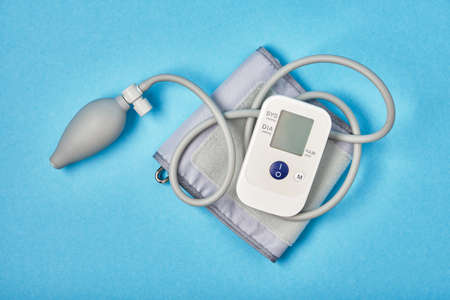blood pressure monitor on blue background copy space top viewの写真素材