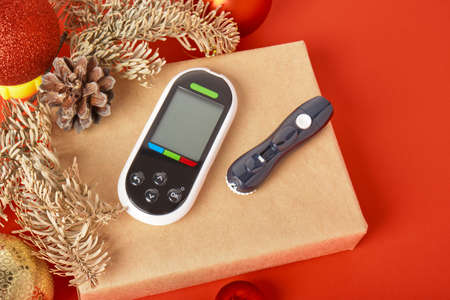 glucose meter on a gift box, Christmas and New Year gifts for diabetics, glucose meter as a gift,...