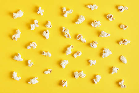 Popcorn on a yellow background. Popcorn pattern. top view, copy space