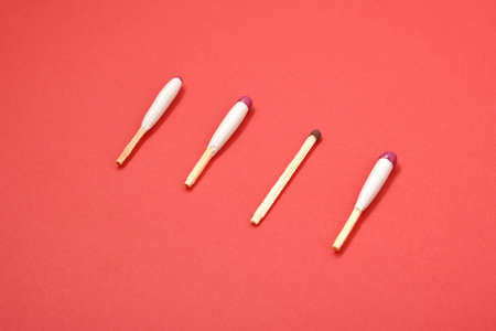 waterproof matches and simple match on red background top viewの写真素材