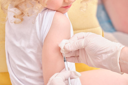 A doctor makes a vaccination to a childの写真素材