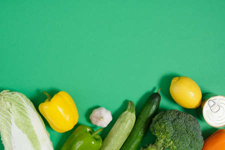 layout of vegetables on a green background top view copy sapceの写真素材