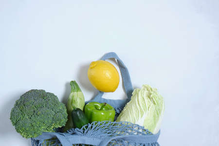 fresh vegetables in eco friendly reusable shopping bag Grocery shopping with eco bag. Sustainable and eco friendly lifestyle concept. Zero waste and plastic free concept.の写真素材
